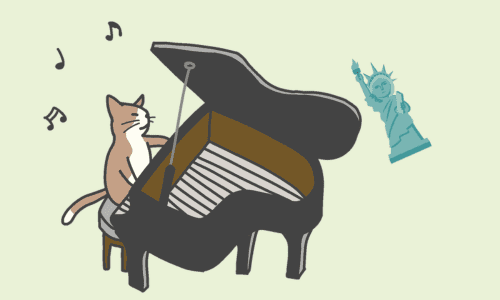 猫のソロ・ピアノ演奏
そばに自由の女神像のおもちゃ